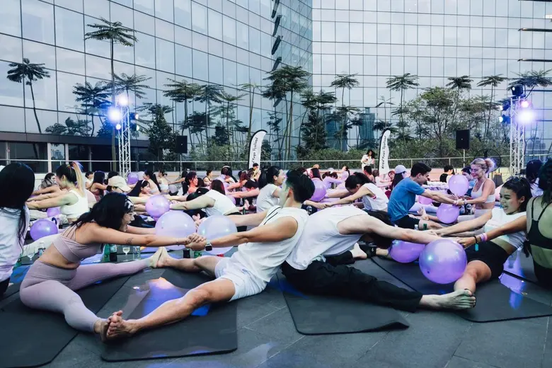 SHE RISES: Brew Yoga &amp; Swing Dance Party. Celebrating Women's Strength, Body and Soul in Bangkok's Rooftop Garden at The PARQ.