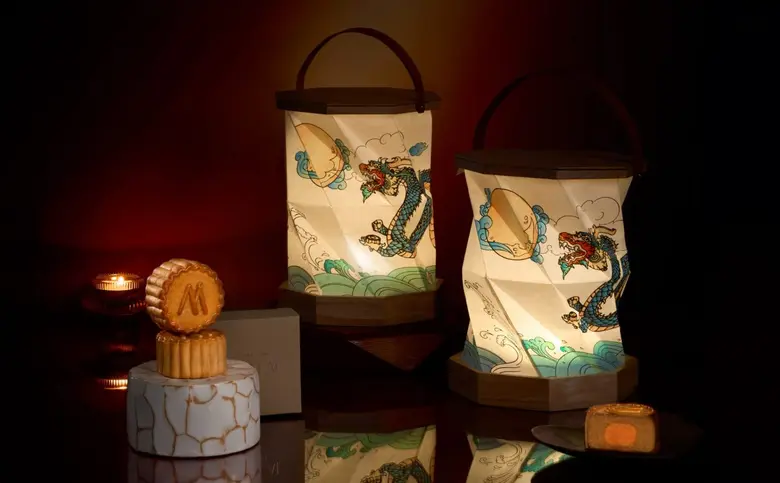 Kimpton maa-lai bangkok debuts its elegant signature mooncake box to celebrate this year's mid-autumn festival in collaboration with ARTSTORY by Autistic Thai